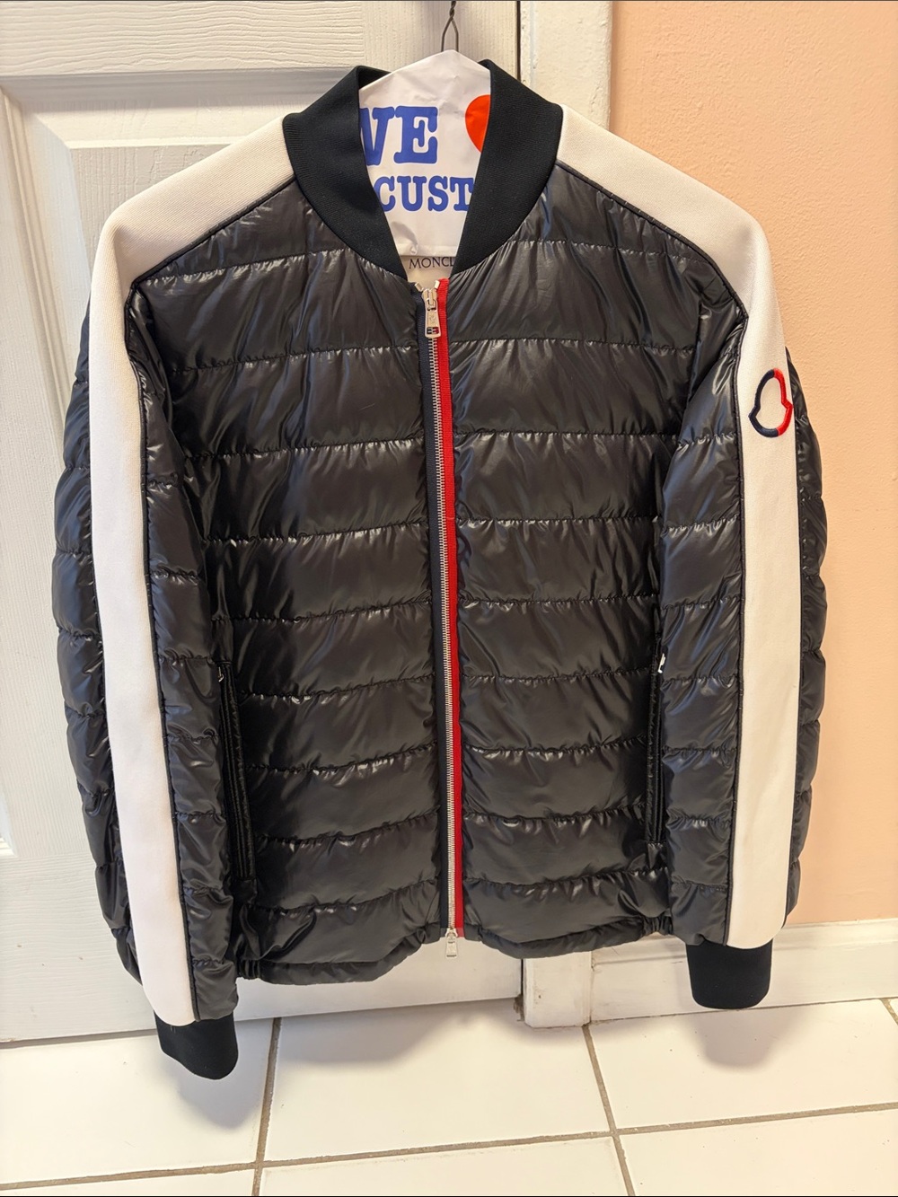 Moncler Black Puffer Jacket with White Sleeve Panels and Red Zip
